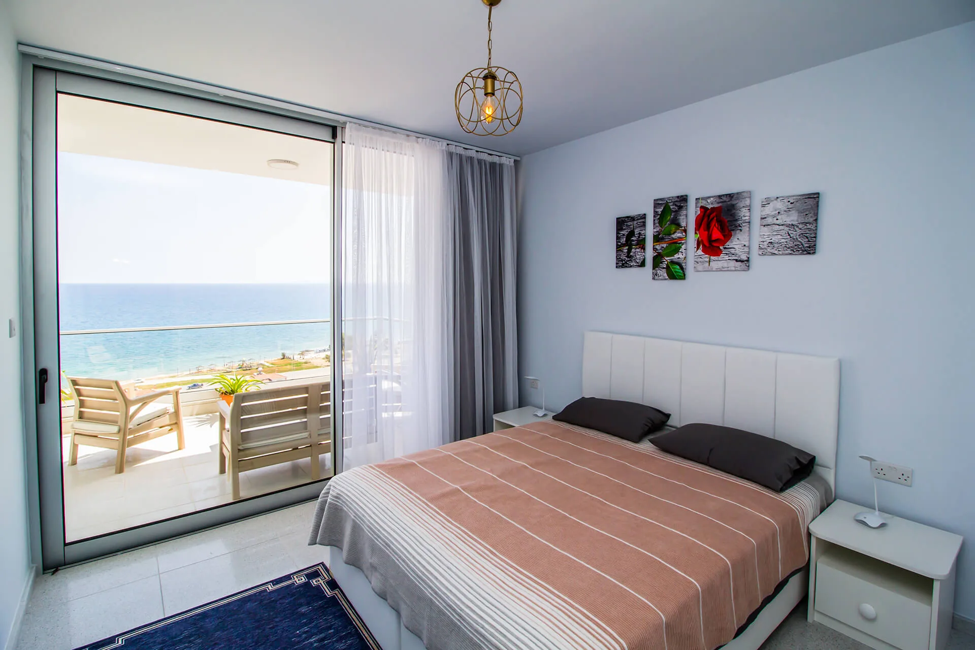 Bedroom with a sea view and balcony at Abelia Residence