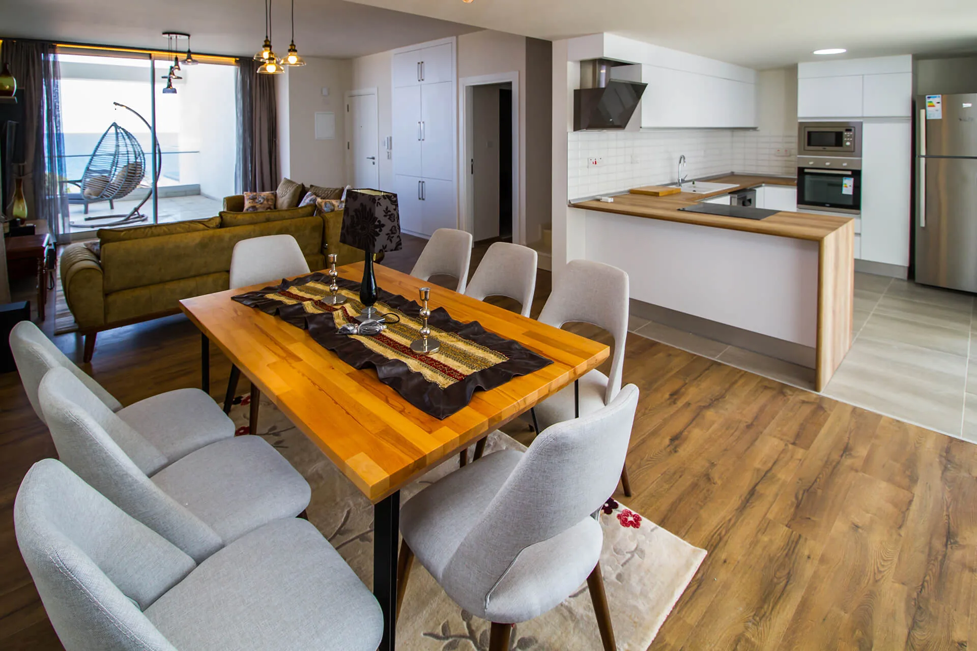 Open plan living, dining and kitchen in an Abelia apartment
